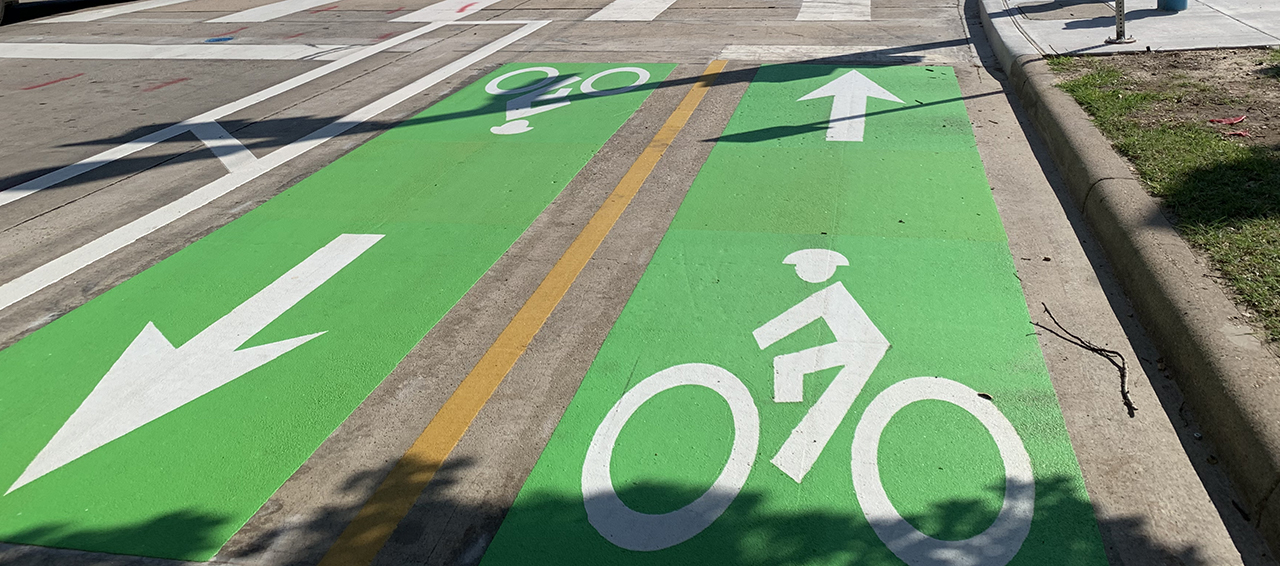 Bikeway stencil on fresh green background