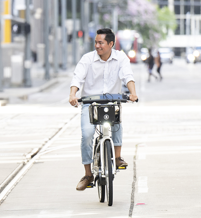 Carlos Iñiguez riding a bike in downtown Houston